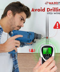 Person using 5 In 1 Stud Finder Wall Scanner With Center Beam Locator And Automatic Calibration next to warning sign.