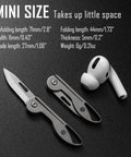 Mini Titanium Pocket Knife For Everyday Carry With Razor Sharp Folding Blade, Ultra Lightweight EDC Tool next to earphone
