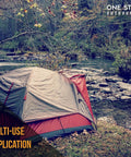 A tent secured by Heavy Duty 12 Inch Round Metal Landscape And Paver Edging Anchoring Spikes 10 Pack by a river
