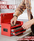 Person using Mini Toolbox With Two Drawers And Top Storage In Durable Steel Smooth Glide Ball Bearing Slides Portable Tool Box Organizer For Garage Workshop School Or Office Use In Red