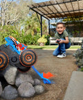 Child playing with Monster Trucks Remote Control Tiger Shark Climber RC Vehicle With Grip Action Tires climbing over rocks.