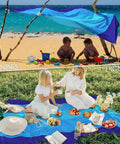 Oversized Beach Blanket 78 By 81 Inches used as awning on beach and picnic mat on grass, blue mixed color, 210T polyester