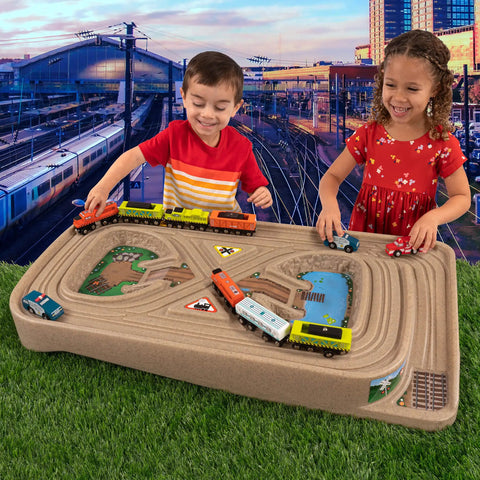Children playing with On The Go Kid Friendly Race Track Table With 2-Sided Play Surface For Cars And Trains, Portable No Assembly Toy