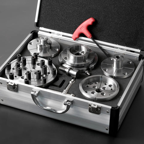 Heavy Duty Wood Lathe Chuck With Self Centering Scroll Jaw System in aluminum carry case, featuring various metallic parts and tools.