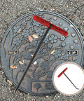 Heavy Duty Steel Manhole Cover Opener With Solid T Handle Grip Rust Resistant Multi Purpose Pull Lifter Hook For Sewer Lid Snagging And Jobsite Hauls No Sweat Tradesman Gear on a manhole lid.