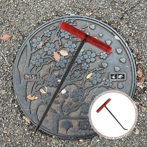 Heavy Duty Steel Manhole Cover Opener With Solid T Handle Grip Rust Resistant Multi Purpose Pull Lifter Hook For Sewer Lid Snagging And Jobsite Hauls No Sweat Tradesman Gear on a manhole lid.