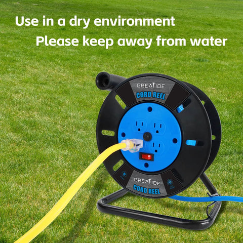 Heavy Duty Extension Cord Reel With Four Grounded Outlets And 10A Circuit Breaker on grass, caution text visible