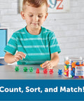 Child playing with 102 Bear Counters For Kids, Toddler Math Toys, Counting Manipulatives For Preschool And Pre K on a table.
