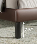 Detail of Rock Solid Heavy Duty Queen Platform Bed Frame With Tufted Wingback Headboard, showing dark brown upholstery and 7.5" leg.
