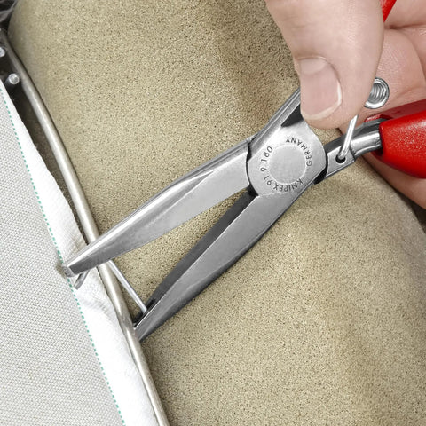 Pro Grade 7 Inch Hog Ring Upholstery Pliers for Automotive Seats and Trim Heavy Duty Tool for Easy Clip Insertion Securing Hog Rings and Upholstery Clips in Recessed Grooves, shown in use crimping upholstery clip.
