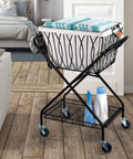 Verona Collapsible Laundry Cart With Removable Canvas Basket Large Black Heavy Duty Steel Construction in a home setting.