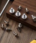 12 Pack Stainless Steel Helmet Screws For Football And Hockey Visors, 12mm And 10mm Facemask Hardware Kit on wood surface
