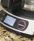 Close-up of Heat N Brew 10 Cup Programmable Coffee Maker With Stainless Steel Finish on kitchen counter