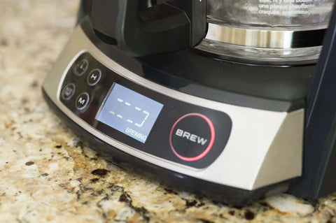 Close-up of Heat N Brew 10 Cup Programmable Coffee Maker With Stainless Steel Finish on kitchen counter