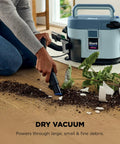Man using EveryMess Ultra Powerful Mess Busting 3 In 1 Wet Vacuum Dry Vacuum And Stain Eliminator cleaning plant soil spill.