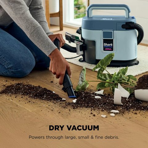 Man using EveryMess Ultra Powerful Mess Busting 3 In 1 Wet Vacuum Dry Vacuum And Stain Eliminator cleaning plant soil spill.