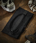 Two Piece Sword Bag Set With Straps 50 Inch Long Katana Cover folded on a textured surface with skulls and sword hilt visible