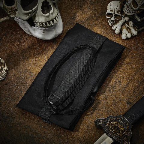 Two Piece Sword Bag Set With Straps 50 Inch Long Katana Cover folded on a textured surface with skulls and sword hilt visible
