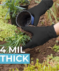 Hands wearing Black Nitrile Gloves Powder Free 4 Mil Medium planting in garden, emphasizing durability and sensitivity.