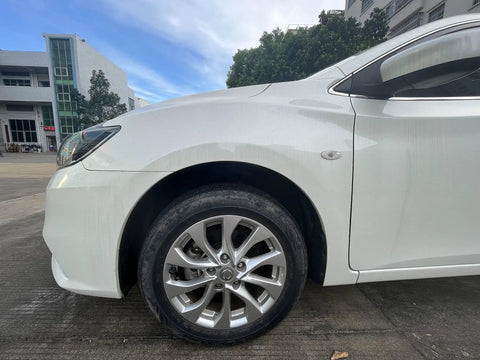 Front view of a white car tire with Glow In The Dark Prank Tire Valve Stem Caps 4 Pack Dust Proof Covers For Cars SUVs Trucks.