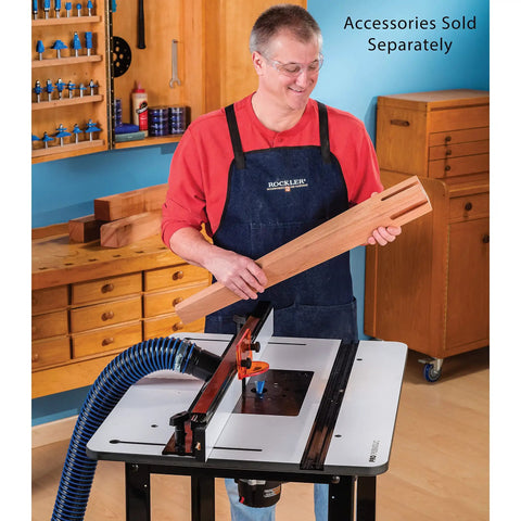 Heavy Duty Solid Phenolic Router Table Top With A Slick Ultra Flat Surface and Tight Ten Point Plate Leveling Rig in use with wood.