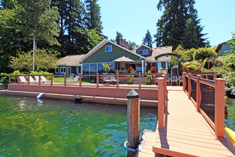 Waterfront house with dock protected by Marine Penetrating Wood Sealer And Waterproofer With Stain For High Moisture Areas Water Based Ultra Low VOC Formula