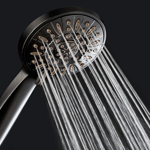 High Pressure Six Setting 4 Inch Handheld Shower Head With Hose In Oil Rubbed Bronze showing water flow close-up