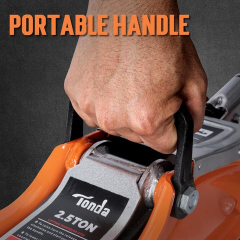 Close-up of hand gripping the handle of the Low Profile Hydraulic Floor Jack, 2.5 Ton Capacity, orange finish for cars and SUVs.