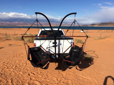 Heavy Duty Hammock Hitch Stand For 2 Inch Receivers Black Finish Mounts Easily To Any Standard 2 Inch Receivers Built Tough Steel Construction Weather Resistant Stand Alone Hammock Mount For Patio Or Backyard with chairs mounted on truck in desert.
