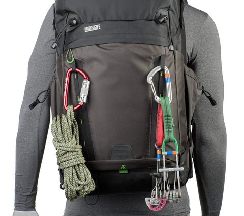 BackLight 36L Outdoor Adventure Camera Daypack Backpack In Woodland Green with climbing gear attached, on mannequin torso
