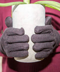 Brown Jersey Winter Work Gloves With Red Fleece Lining for all day comfort and warmth holding a potted plant