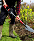 Person using Multi Digger Garden Spade With Reinforced Fiberglass Handle in garden, lightweight arrow head shovel with dual soft grip