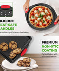 Deluxe Nonstick Bakeware Set 8 Piece Kitchen Pan Collection With Pizza Pan, gray inside coating, red silicone handles. Close-up view of bakeware with cookies and pizza.