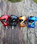 Colorful bow stabilizer weight balance bars with shock absorber, featuring red, black, orange, and blue anodized aluminum design.