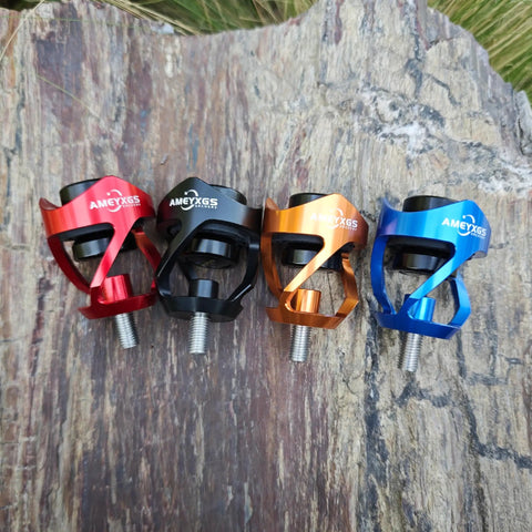Colorful bow stabilizer weight balance bars with shock absorber, featuring red, black, orange, and blue anodized aluminum design.