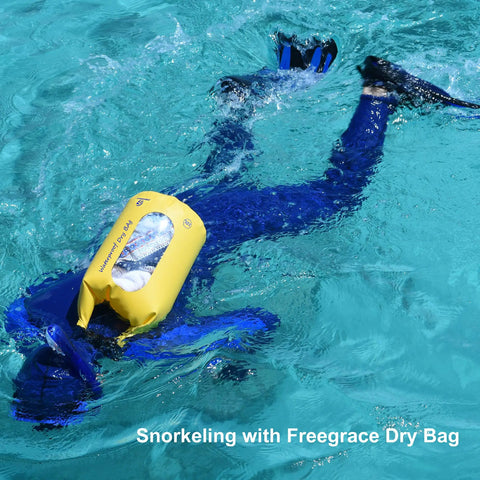 Person snorkeling with yellow 5L Waterproof Dry Bag Set Of 3 With Double Zip Locks Includes Waist Pouch And IPX8 Phone Case
