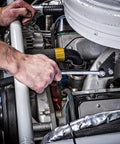 Mechanic using 18 Piece 12 Point Long Pattern Metric Wrench Set With Off Corner Loading For Sure Grip in engine bay