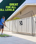 Man using Limited Edition Black Golf Practice Net With Large 10 Ft By 7 Ft Hitting Space Pro Grade Personal Driving Range