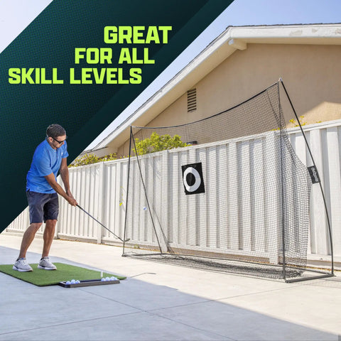 Man using Limited Edition Black Golf Practice Net With Large 10 Ft By 7 Ft Hitting Space Pro Grade Personal Driving Range