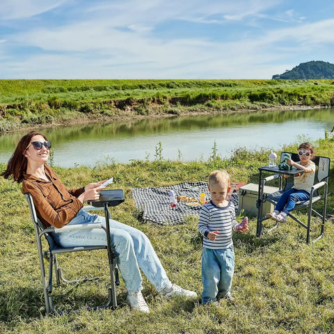 People outdoors using Heavy Duty 300 Lb Folding Director Chair With 2 Way Rotating Side Table, cup holder, and ergonomic mesh back