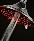 Ultra Luxe 8 Inch Rainfall LED Shower Head With Five Settings Chrome Face Water Powered Color Changing Temperature LEDs Spa Quality Bath Upgrade For Your Home, illuminated with red lights, water flowing.