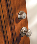 660 Series Single Cylinder Deadbolt Lock In Satin Nickel With SmartKey Rekey Security on wooden door