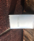 Universal Stainless Steel Hurricane Window Clips For 1/2 To 3/4 Inch Plywood Or OSB, showing clip securing to masonry wall