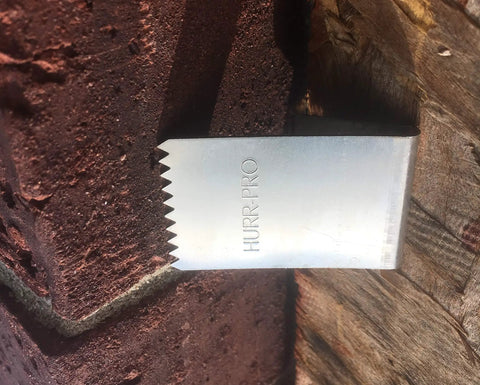 Universal Stainless Steel Hurricane Window Clips For 1/2 To 3/4 Inch Plywood Or OSB, showing clip securing to masonry wall
