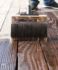 Deck Stain Brush 7.5 Inch Wood Stain Applicator With Premium Synthetic Bristles applying stain on wooden deck surface