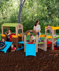 Children playing on Young Explorers Modular Outdoor Playset For Kids Ages 18 Months To 6 Years with slide and playhouse