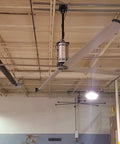 Heavy Duty Twenty Foot Industrial Ceiling Fan Using High Volume Low Speed Technology in a warehouse setting.