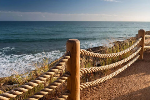 Heavy Duty Manila Rope 1-1/2 Inch By 50 Feet Pure Number 1 Abaca Fiber Brown used as fencing on seaside boardwalk