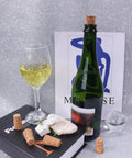 Natural Wood Corks 100 Pack For Wine Beer And Liquor Bottles Handy Tapered Wooden Stopper Plugs Bulk next to wine bottle and glass