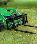 Dual Mount Tractor Pallet Forks For Front End Loader And 3 Point Hitch With 2 Inch Receiver Chain Hooks Weight Rack Gooseneck Mount Built Tough Black 36 Inch JDQA attached to green tractor on grass.